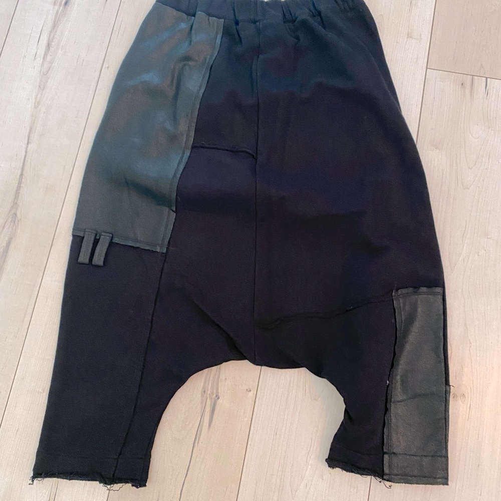 Dropped crotch B3 black pants with leather details.